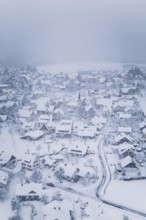 A wintry village with snow-covered houses and peaceful atmosphere, Schopfloch, Freudenstadt
