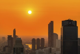 Over the rooftops of Bangkok, sunset, view from the Moon Bar on the roof terrace of the Banyan Tree