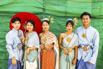A group of young people wearing traditional clothing presents themselves for the photographers, Wat