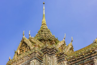 Chedi temple tower with ceramic inlays, Wat Arun Buddhist temple, Bangkok, Thailand's metropolis,
