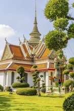 Wat Arun, Buddhist temple, overlapping roofs with curved chofas and Chedi temple tower, Bangkok,