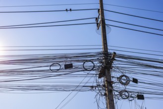 Confusing tangle of cables on a power pole, Bangkok, Thailand's metropolis, Thailand