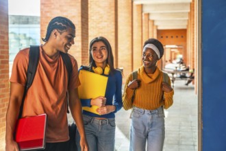 Diverse students walking, carrying books and backpacks, communicating happily while moving through