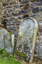 Church and cemetery over Borthwick Castle, Midlothian, Scotland, UK