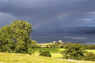 View of rainbow over Forth Estuary from House of the Binns, Linlithgow, Scotland, UK