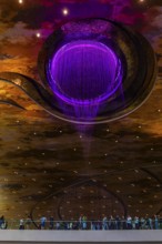 Artificial, brightly lit waterfall, Magic Waterfall, falls from the ceiling of the Iconsiam