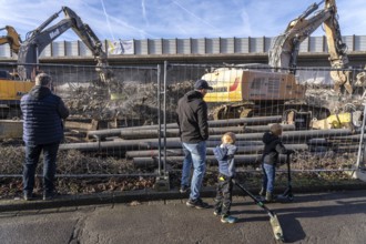 Spectators, teethers during the demolition of the 120 meter long motorway bridge of the A516,