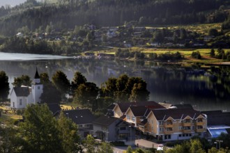 Idyllic village on the Hardangerfjord with a lakeside church, Ulvik, null, Norway