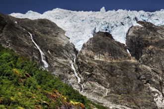 Massive glacier tongue of Supphellebreen between steep rock faces