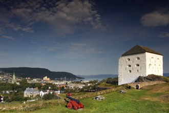 The Kristianstenfestning towers over Trondheim with city view and cannon, Trondheim, Norway