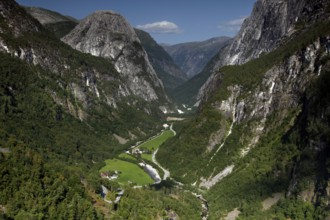 Breathtaking view of the Nærøy Valley with green valley floor and steep rock walls, Stalheim,