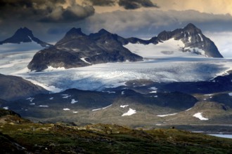 Impressive Skagastølstindane mountains and glaciers in the Sognefjell, partly covered by clouds,