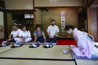 Introduction to a tea ceremony with guests in a traditional setting, Kyoto, Higashiyama, Japan