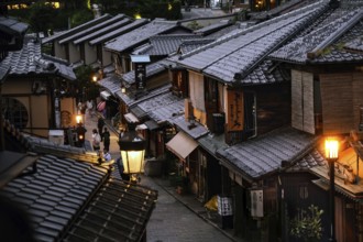 Atmospheric night view of a traditional shopping street with illuminated lanterns, Kyoto, Kyoto,