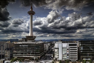 Dramatic clouds over Kyoto Tower with view from Central Station, Kyoto, Kansai, Japan