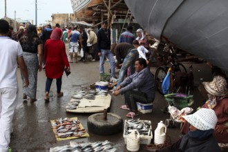 Street vendors sell fish products along the port in Essaouira, Essaouira, Morocco