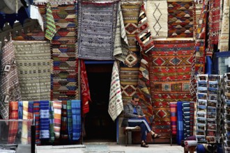 Traditional souk with colorful carpets and textiles in the old town, Essaouira, null, Morocco