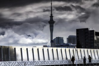 View of Karangalape Road with Sky Tower and dramatic sky, Auckland, null, New Zealand