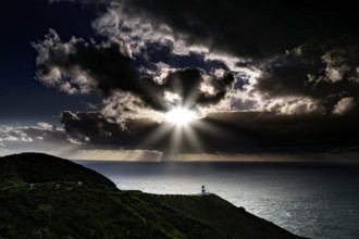 Mystical coastal landscape near Cape Reinga with dramatic sunset and clouds, Cape Reinga,