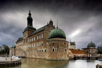 Majestic castle in Vadstena on the Göta Canal under cloudy sky, Vadstena, Östergötland, Sweden