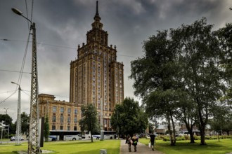 Latvian Academy of Sciences in Riga on a cloudy day with surrounding greenery, Riga, Latvia