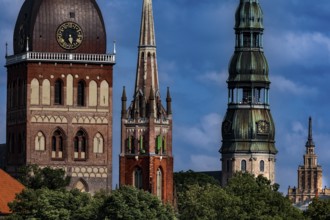 Cathedral towers, Anglican Church and St. Peter's Church in Riga against a blue sky, Riga, Vidzeme,