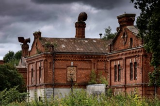 Ruined brick tsarist barracks surrounded by vegetation, Liepaja, Karosta, Latvia