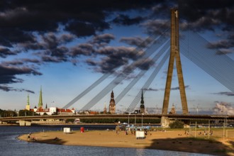 Beach on the Düna with a view of the Vansu Bridge and skyline of Riga, Riga, Vidzeme, Latvia