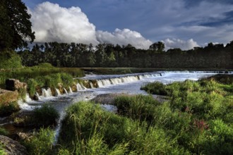 The Ventas Rumba waterfall in Kuldiga with running water and green surroundings, Kuldiga, Courland,