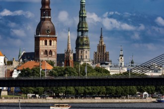 Riga's silhouette with churches on the Düna and distinctive bridge, Riga, Latvia
