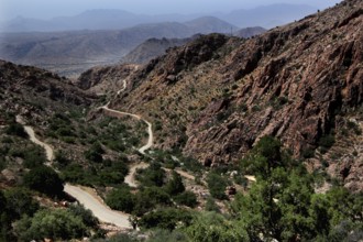 Curvy road through a vast, dry mountain landscape, Anergui, zero, Morocco