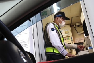 Cashier at a toll station in Kobe, Kobe, Japan