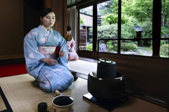 Tea master in traditional kimono during a tea ceremony, Kyoto, Higashiyama, Japan