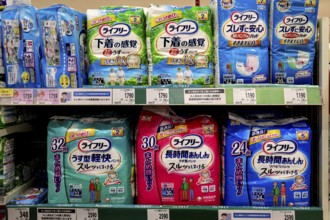 Shelf in Matsumoto supermarket with various diaper brands, Matsumoto, Nagano, Japan