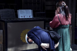 People pray at Chureito Shrine, an atmosphere of spirituality, Fujiyoshida, Japan