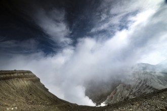 Nakadake crater in morning light with dramatic clouds and geological contrasts, Aso, Kumamoto,