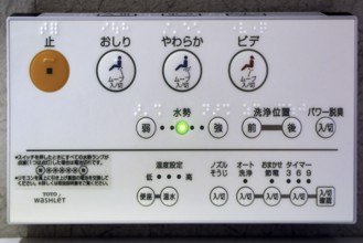 Control panel of a modern toilet at Ryokan Minshuku Asogen in Aso, Aso, Japan