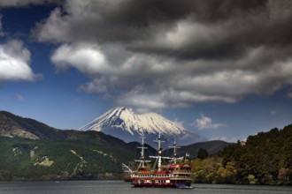 A pirate ship sails on the Ashinoko with the majestic Fujiyama in the background, Hakone, Japan