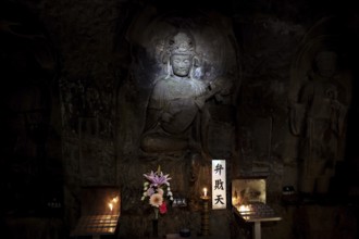 Illuminated Buddha relief in a cave at the Hare Dera Temple in Kamakura, Kamakura, Kanagawa, Japan