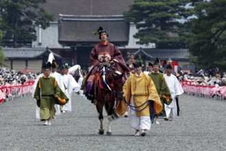 Riders wearing traditional clothing at the Aoi Matsuri procession, Kyoto, Japan