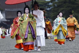 Geishas in traditional dress during the Aoi Matsuri procession, Kyoto, Japan