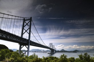 Impressive Seto Ohashi Bridge stretches across the sea under a cloudy sky, Seto, Japan