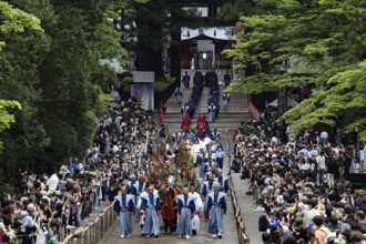 Solemn procession through the streets of Nikko surrounded by spectators, Nikko, Japan