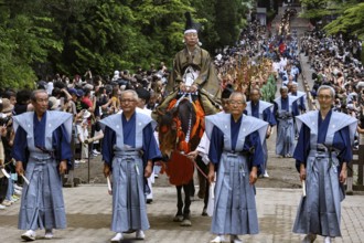 Warriors in traditional dress lead the procession in Nikko, Nikko, Japan