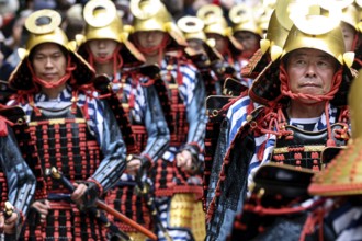 Warriors wearing elaborate armor march during a parade in Nikko, Nikko, Japan