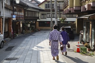 Yukata bathers stroll the quiet streets of Yamanouchi, Yamanouchi, Japan
