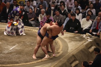 Intense sumo ring scene at Ryogoku Kokugikan Hall, Tokyo, Japan