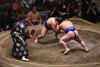 Intensive sumo fight in Kokugikan with a large audience, Tokyo, Ryogoku, Japan