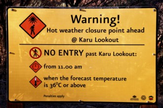 Warning sign in the Valley of the Winds with information about access times, Kata Tjuta, Northern