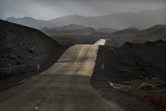 Deserted road in mountainous landscape with gloomy sky in Ahmedela, Ahmedela, Ethiopia